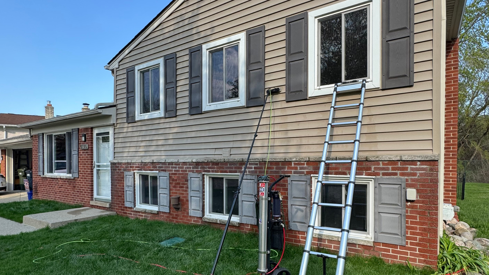Window cleaning at a two-story colonial home in Sterling Heights, MI