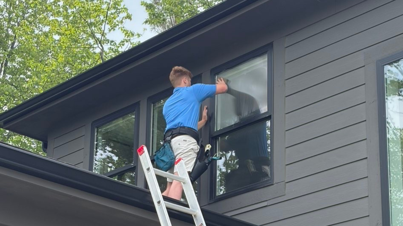 Residential window cleaning on a two-story colonial home in Utica, MI